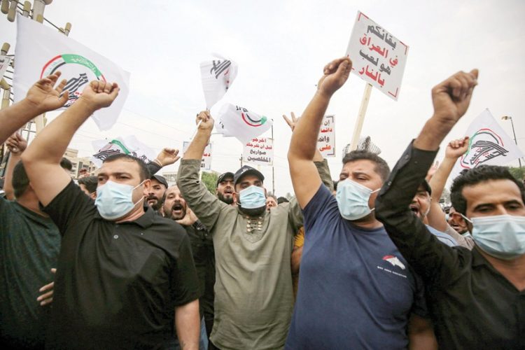 أنصار الحشد الشعبي يتظاهرون في بغداد للمطالبة بانسحاب القوات الأمريكية 1 أنصار الحشد الشعبي يتظاهرون في بغداد للمطالبة بانسحاب القوات الأمريكية